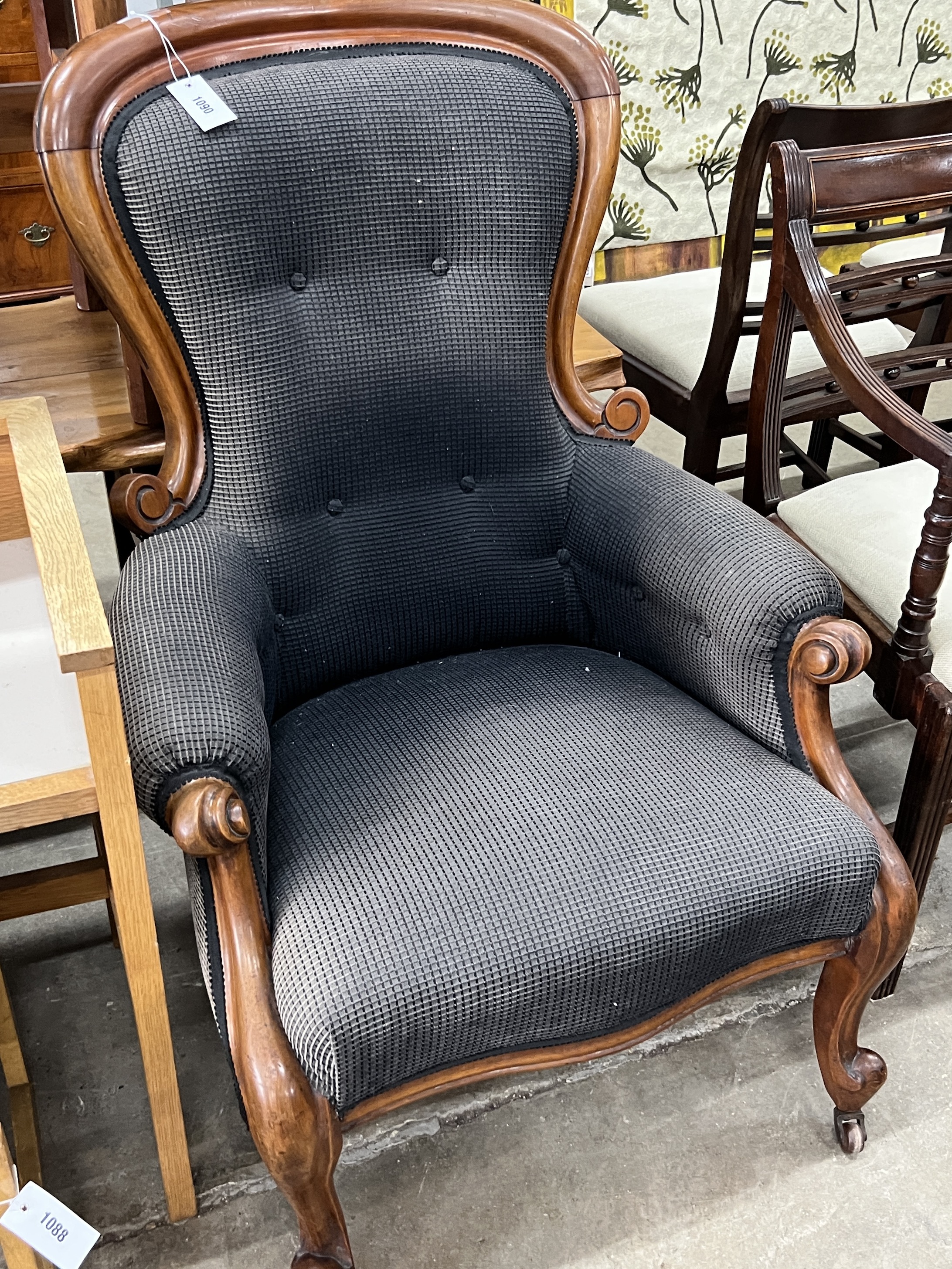 A Victorian mahogany spoonback armchair, width 72cm, depth 62cm, height 104cm